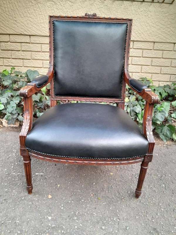 A 19th Century French Pair of Carved Walnut Armchairs Upholstered in  Leather