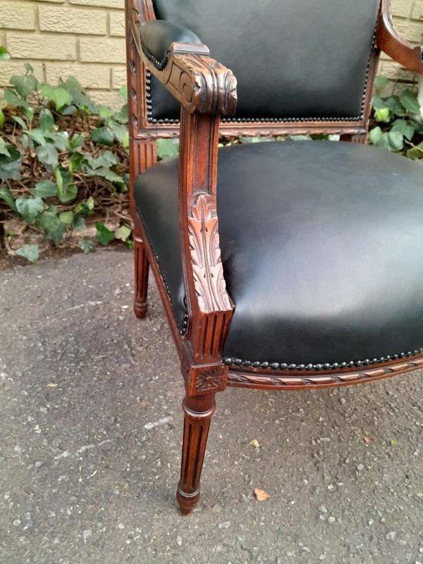A 19th Century French Pair of Carved Walnut Armchairs Upholstered in  Leather
