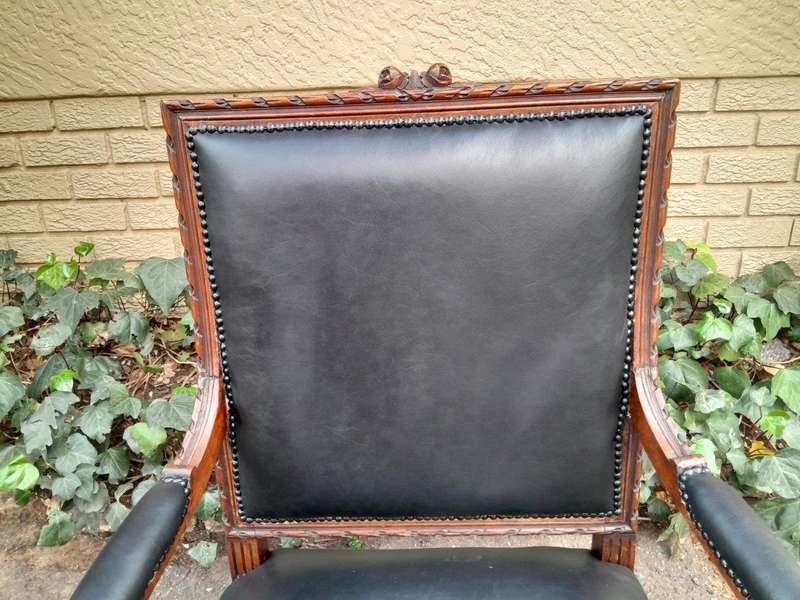 A 19th Century French Pair of Carved Walnut Armchairs Upholstered in  Leather