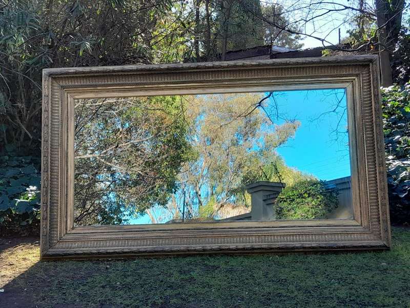 A 19th Century Carved Giltwood And Gesso Mirror Of Large Proportions