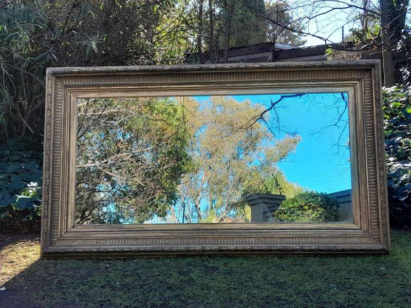 A 19th Century Carved Giltwood And Gesso Mirror Of Large Proportions