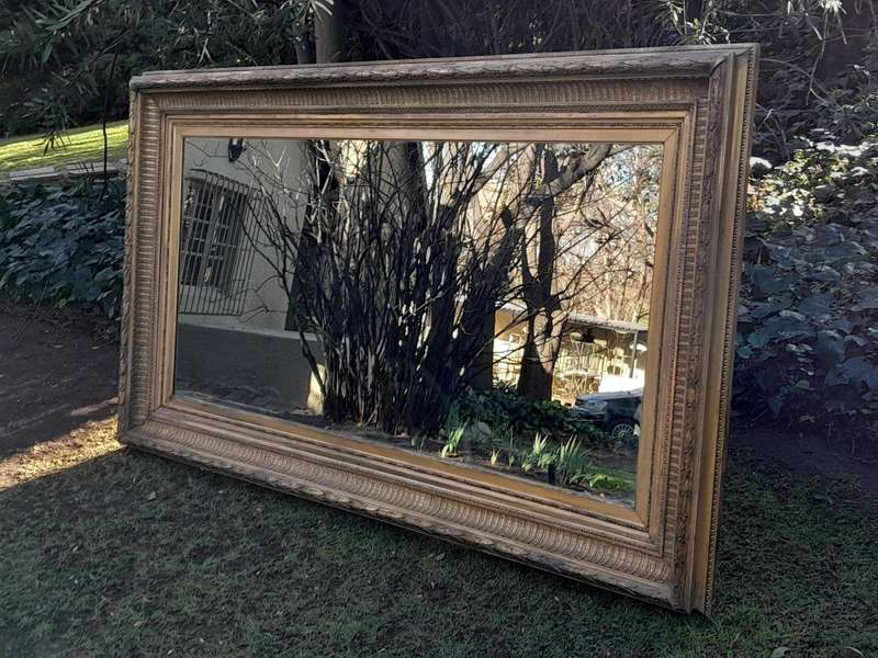 A 19th Century Carved Giltwood And Gesso Mirror Of Large Proportions