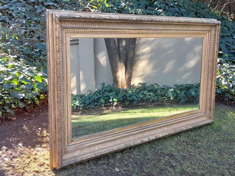 A 19th Century Carved Giltwood And Gesso Mirror Of Large Proportions