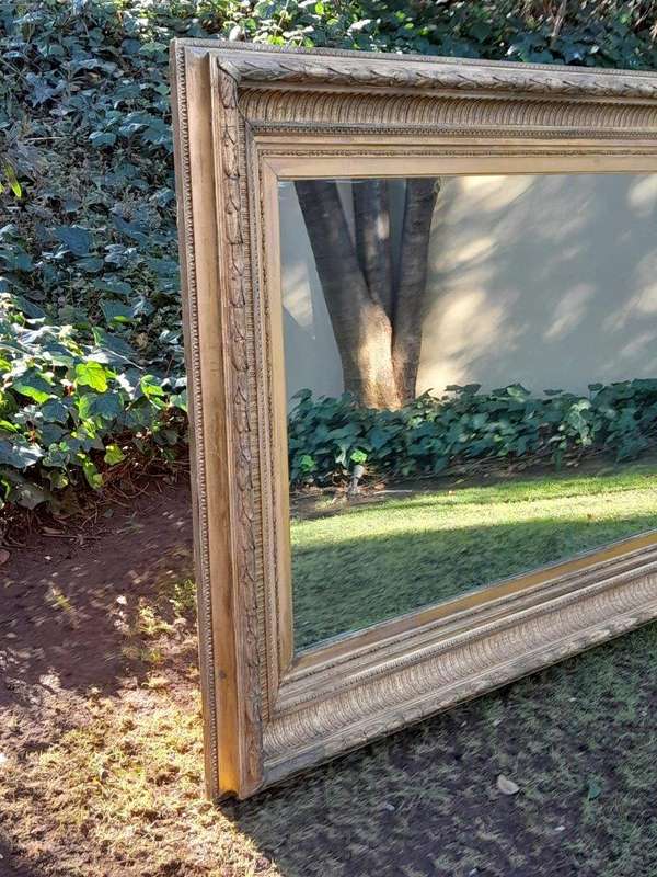 A 19th Century Carved Giltwood And Gesso Mirror Of Large Proportions