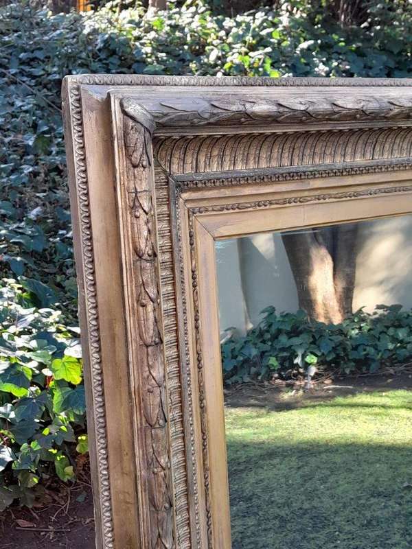 A 19th Century Carved Giltwood And Gesso Mirror Of Large Proportions