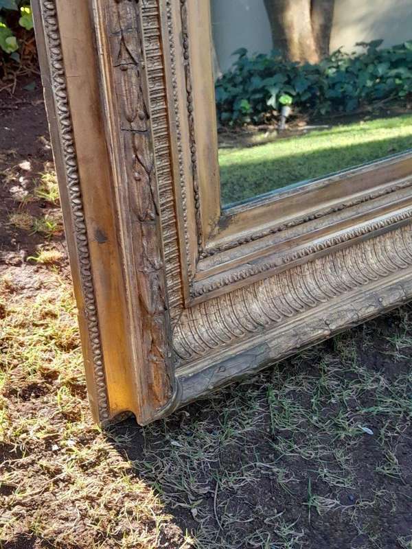 A 19th Century Carved Giltwood And Gesso Mirror Of Large Proportions