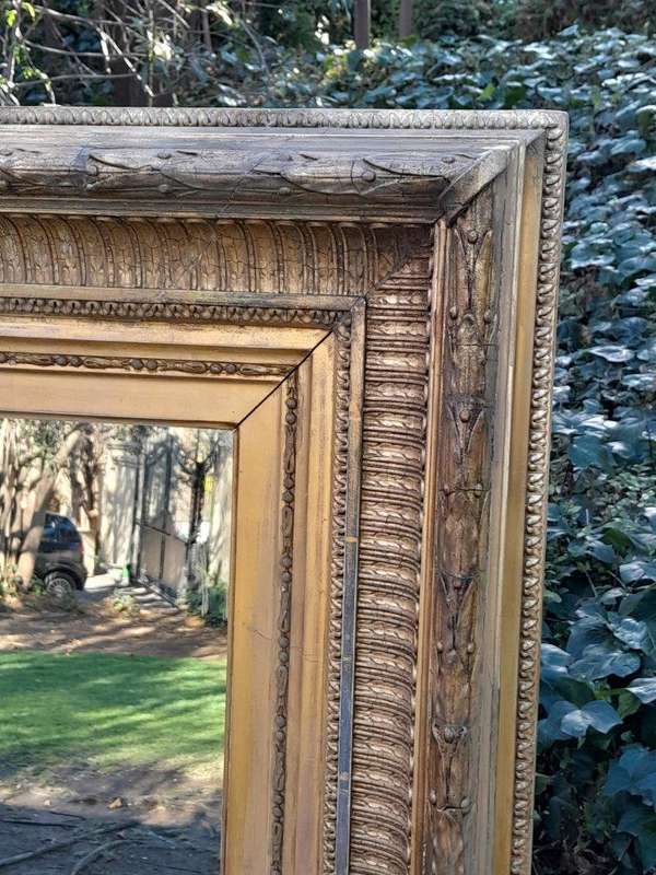 A 19th Century Carved Giltwood And Gesso Mirror Of Large Proportions
