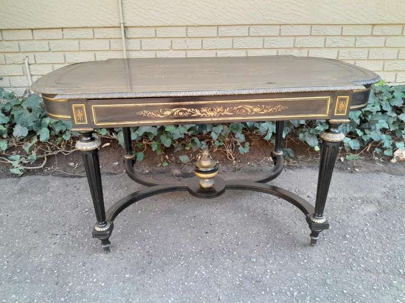 A 19th Century French Ebonised and Brass inlay and Metal Mounted Table with Drawer