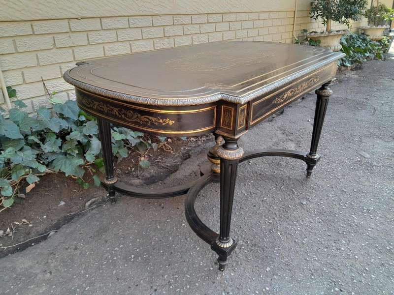 A 19th Century French Ebonised and Brass inlay and Metal Mounted Table with Drawer