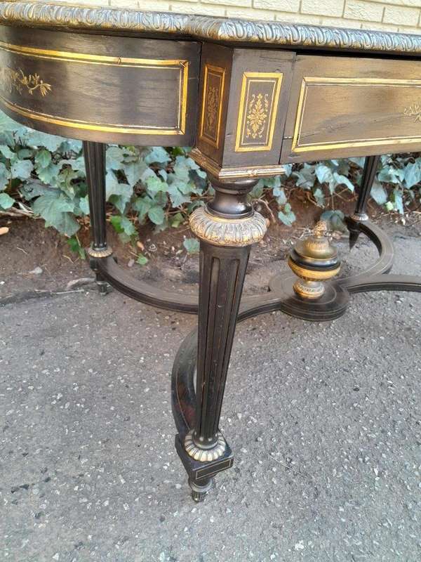 A 19th Century French Ebonised and Brass inlay and Metal Mounted Table with Drawer