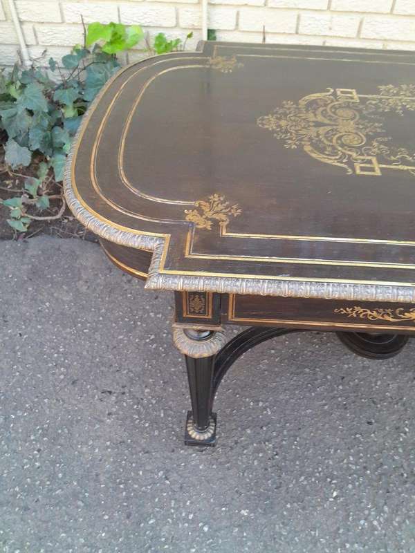 A 19th Century French Ebonised and Brass inlay and Metal Mounted Table with Drawer
