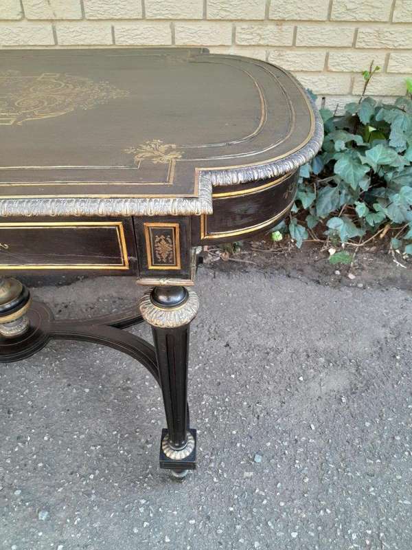 A 19th Century French Ebonised and Brass inlay and Metal Mounted Table with Drawer
