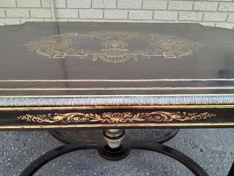 A 19th Century French Ebonised and Brass inlay and Metal Mounted Table with Drawer