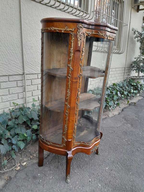 A 20th Century French Mahogany Vitrine With Gilded Metal Embellishments