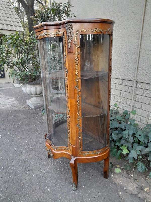 A 20th Century French Mahogany Vitrine With Gilded Metal Embellishments