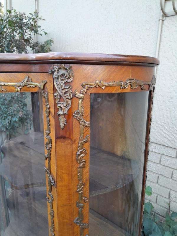 A 20th Century French Mahogany Vitrine With Gilded Metal Embellishments