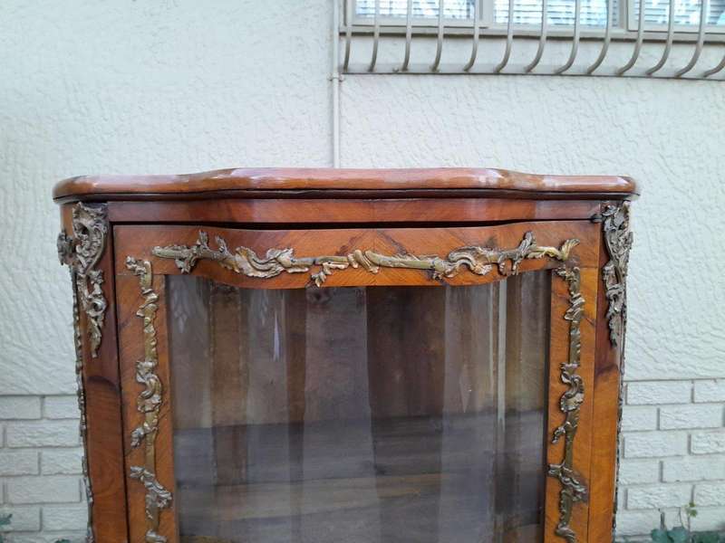 A 20th Century French Mahogany Vitrine With Gilded Metal Embellishments