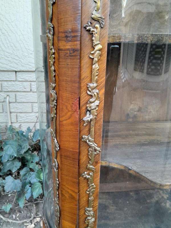 A 20th Century French Mahogany Vitrine With Gilded Metal Embellishments