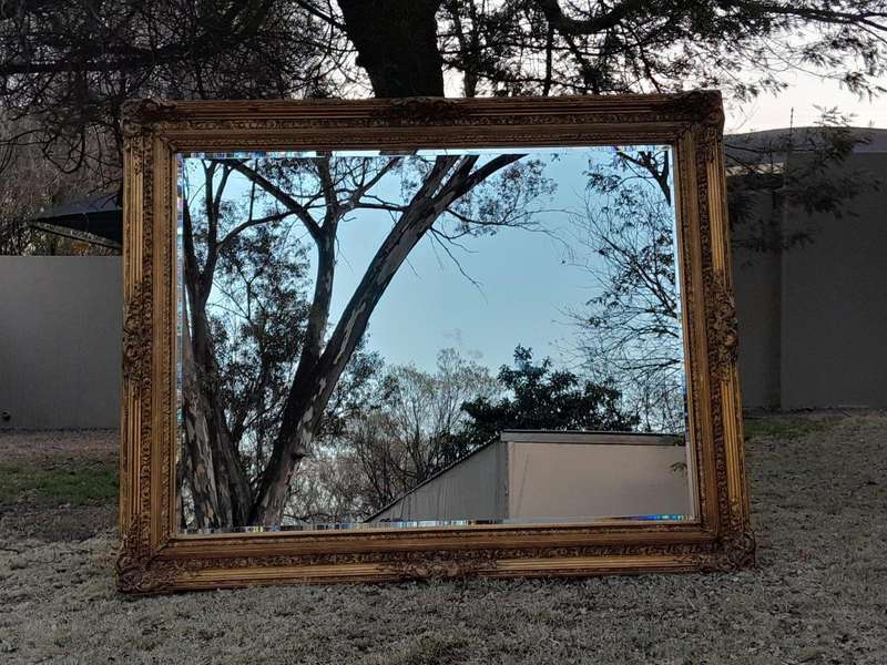 A Massive 20TH Century French Style Ornately Carved And Gilded Bevelled Mirror Of Large Proportions