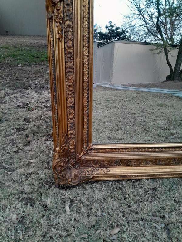 A Massive 20TH Century French Style Ornately Carved And Gilded Bevelled Mirror Of Large Proportions