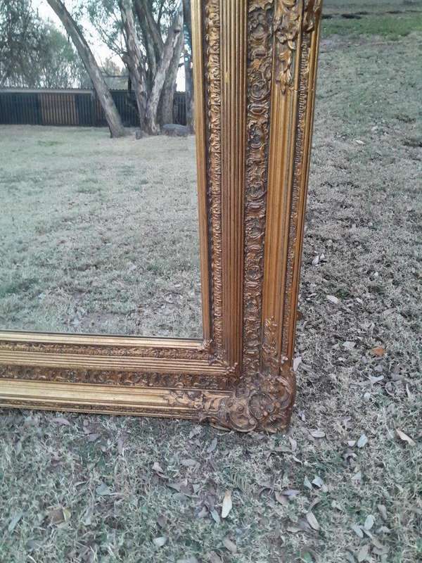 A Massive 20TH Century French Style Ornately Carved And Gilded Bevelled Mirror Of Large Proportions
