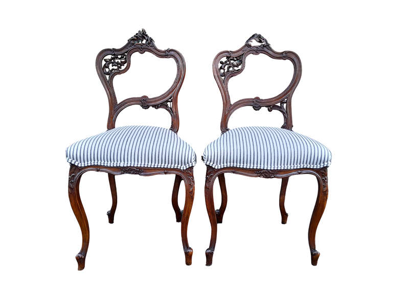 An Early 20th Century Pair Of French Carved Mahogany Chairs