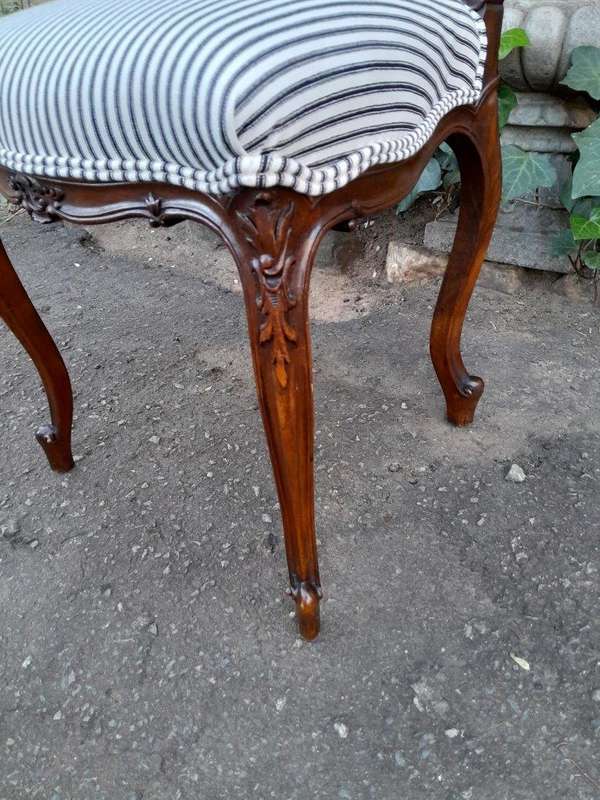 An Early 20th Century Pair Of French Carved Mahogany Chairs