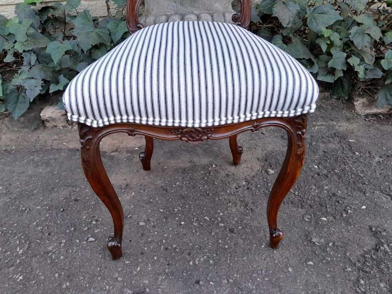 An Early 20th Century Pair Of French Carved Mahogany Chairs