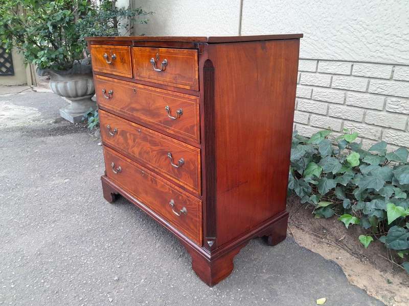 An Antique George III Style Flame Mahogany Chest Of Drawers On Bracket Feet