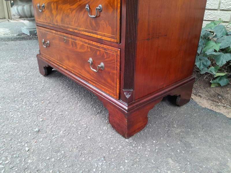 An Antique George III Style Flame Mahogany Chest Of Drawers On Bracket Feet