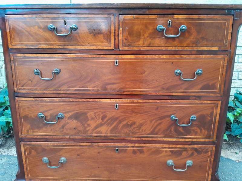 An Antique George III Style Flame Mahogany Chest Of Drawers On Bracket Feet