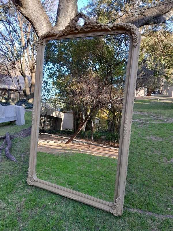 A French Style Ornately Carved Mirror in a Contemporary Finish