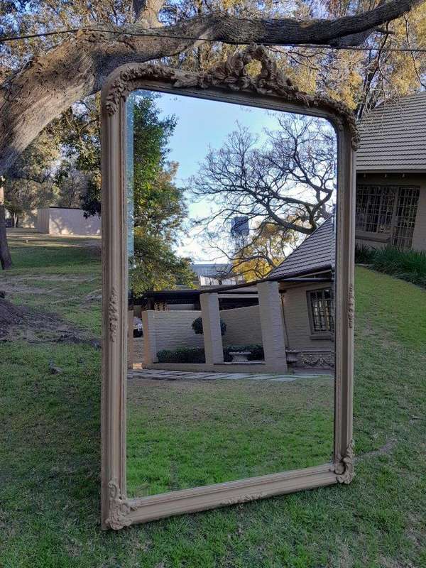 A French Style Ornately Carved Mirror in a Contemporary Finish
