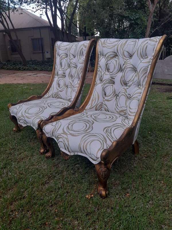 A 20th Century Pair of French Style Gilded Slipper Chairs Upholstered in a Custom Made Fabric