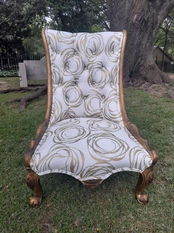 A 20th Century Pair of French Style Gilded Slipper Chairs Upholstered in a Custom Made Fabric