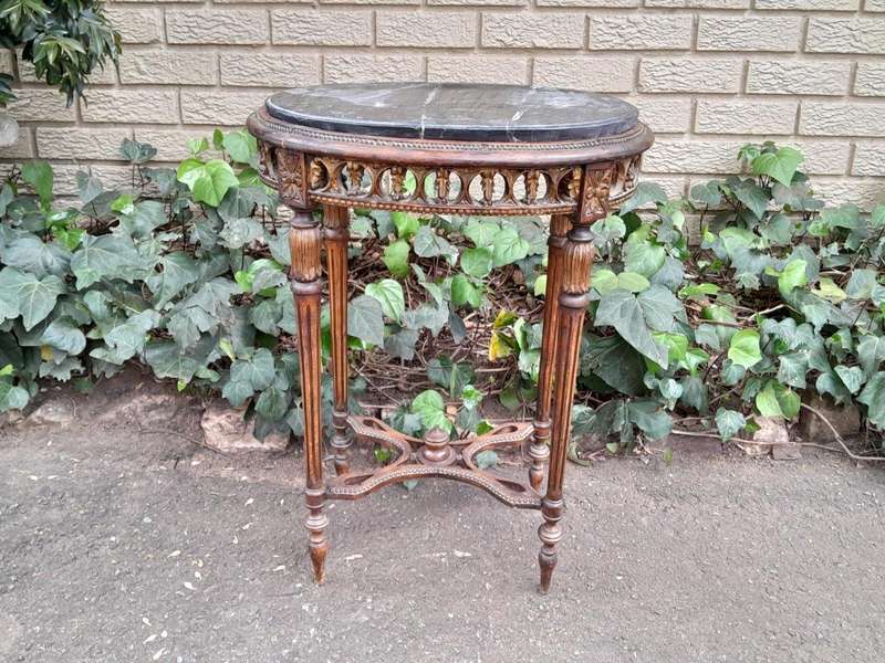 An Antique French Giltwood Table with Marble Top