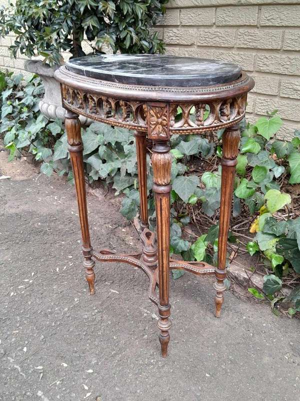 An Antique French Giltwood Table with Marble Top
