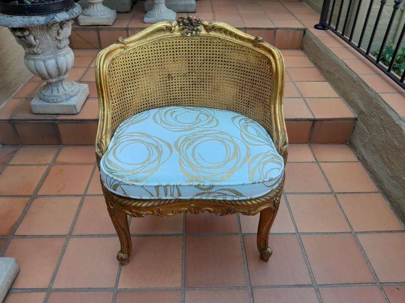 A 20th Century French Style Giltwood Rattan Chair Upholstered In Hand Printed Gold Design Fabric 