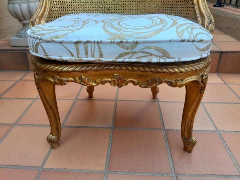 A 20th Century French Style Giltwood Rattan Chair Upholstered In Hand Printed Gold Design Fabric 