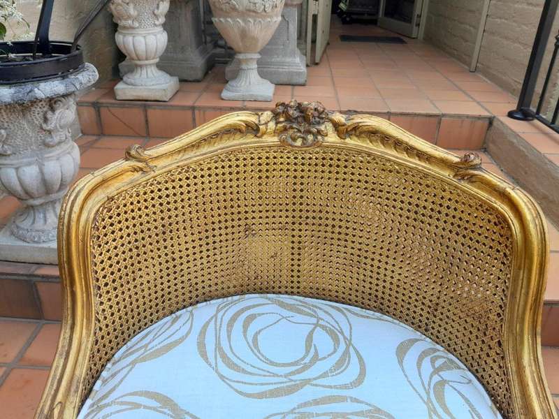 A 20th Century French Style Giltwood Rattan Chair Upholstered In Hand Printed Gold Design Fabric 