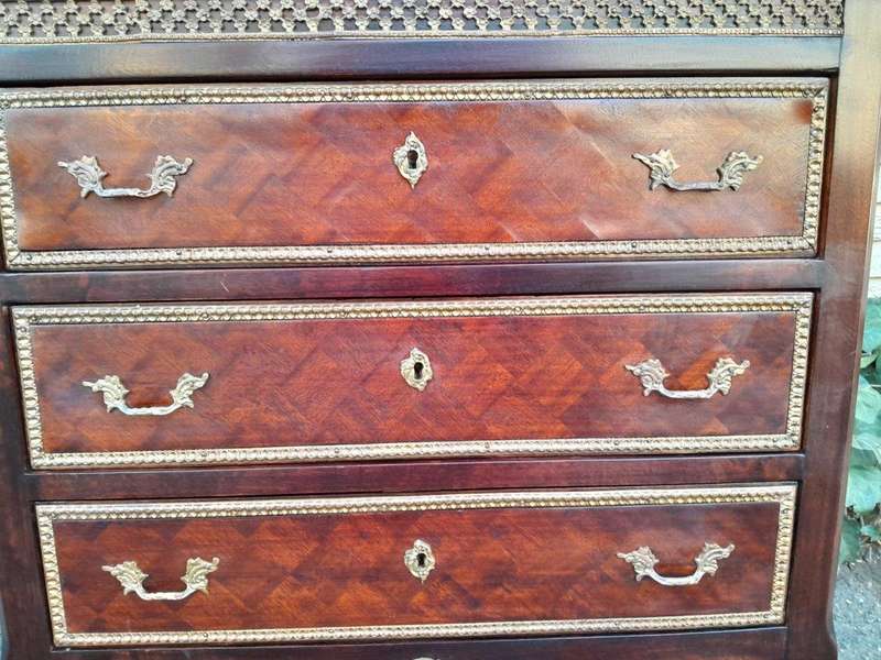 A 20th Century Parquetry Chest Of Drawers With Gilt Mounts And Marble Top