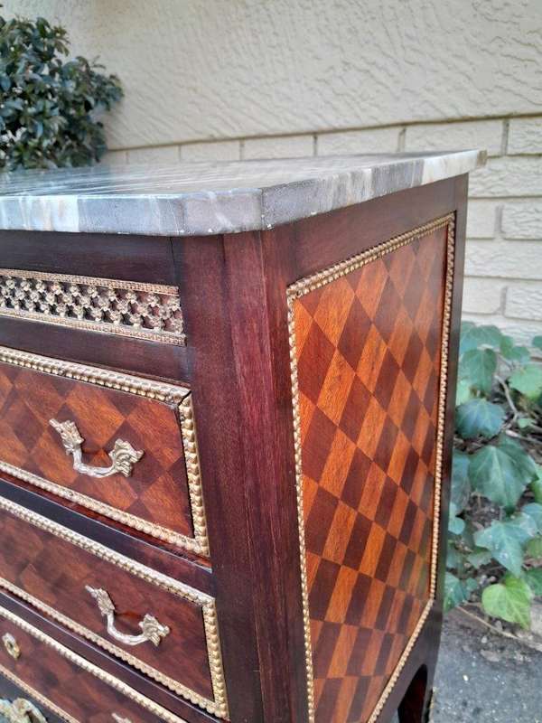 A 20th Century Parquetry Chest Of Drawers With Gilt Mounts And Marble Top