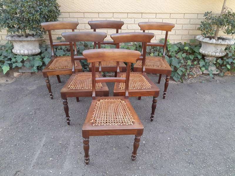 An Antique Set Of Six Cape Stinkwood Regency Chairs With Rattan Seats