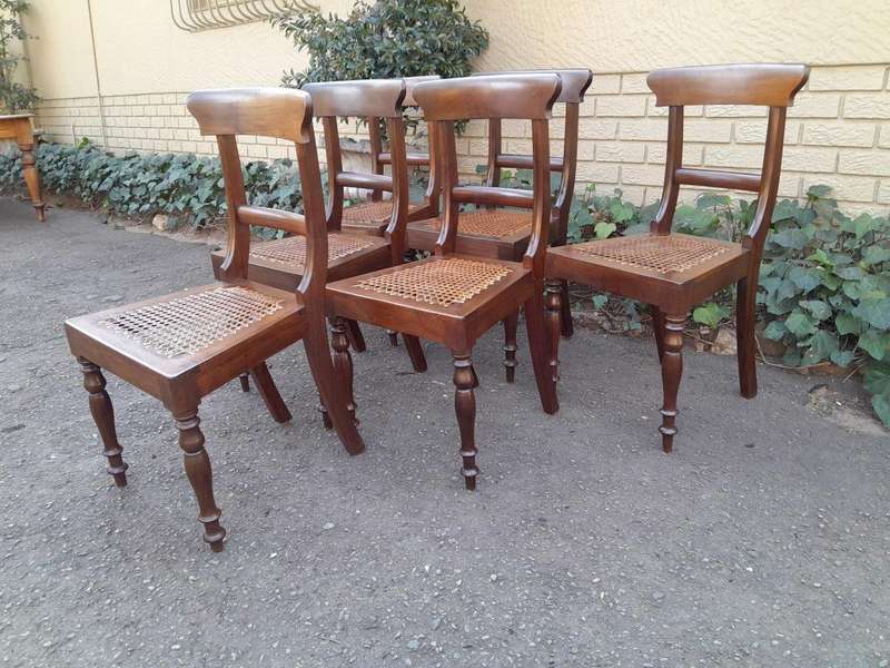 An Antique Set Of Six Cape Stinkwood Regency Chairs With Rattan Seats