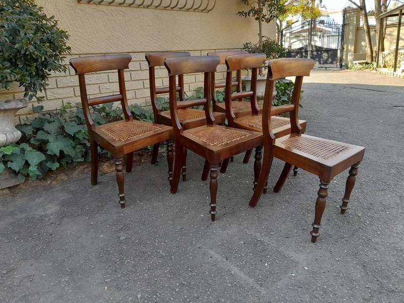 An Antique Set Of Six Cape Stinkwood Regency Chairs With Rattan Seats