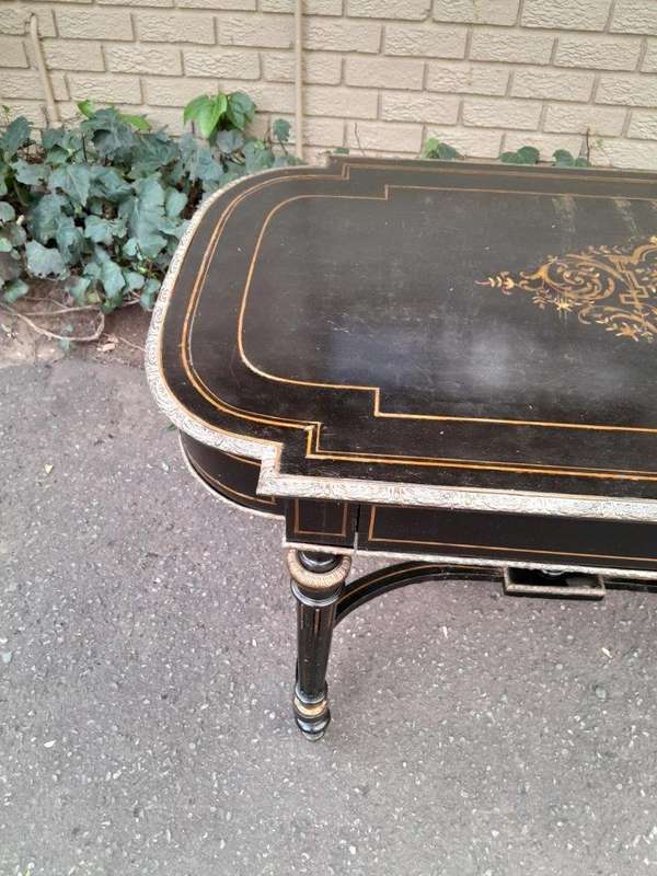 An Antique Victorian Ebonised and with Brass and Mother of Pearl Inlay Table with Drawer