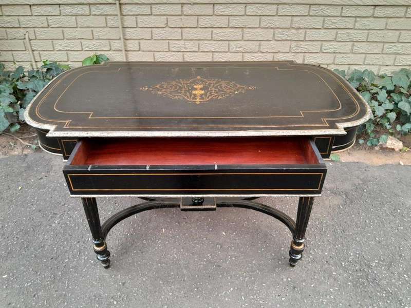An Antique Victorian Ebonised and with Brass and Mother of Pearl Inlay Table with Drawer
