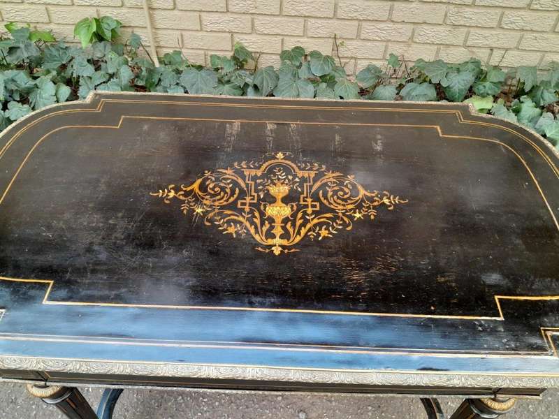 An Antique Victorian Ebonised and with Brass and Mother of Pearl Inlay Table with Drawer