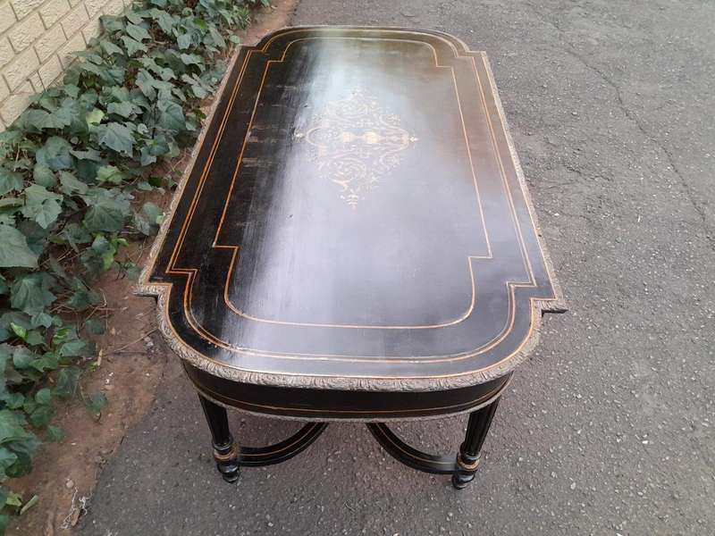 An Antique Victorian Ebonised and with Brass and Mother of Pearl Inlay Table with Drawer
