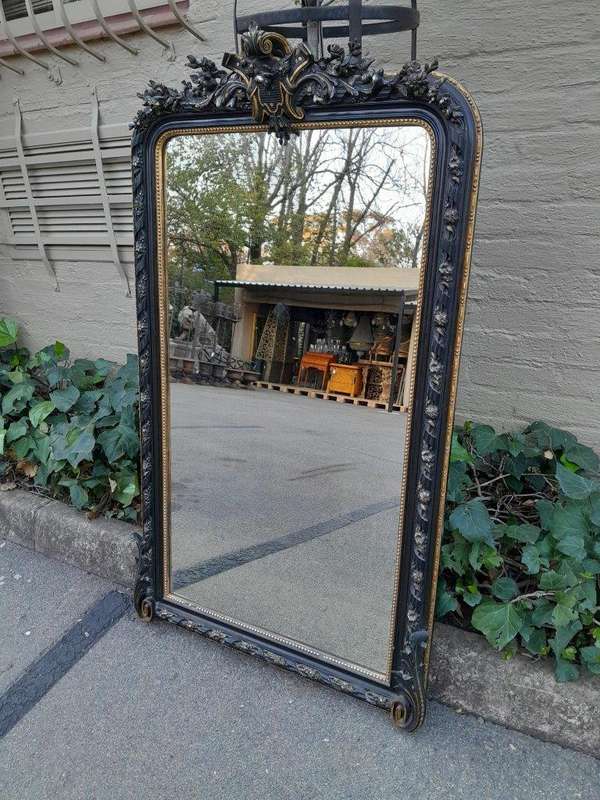 A 20th Century French Style Ebonized Hand-Gilt Ornate Mirror